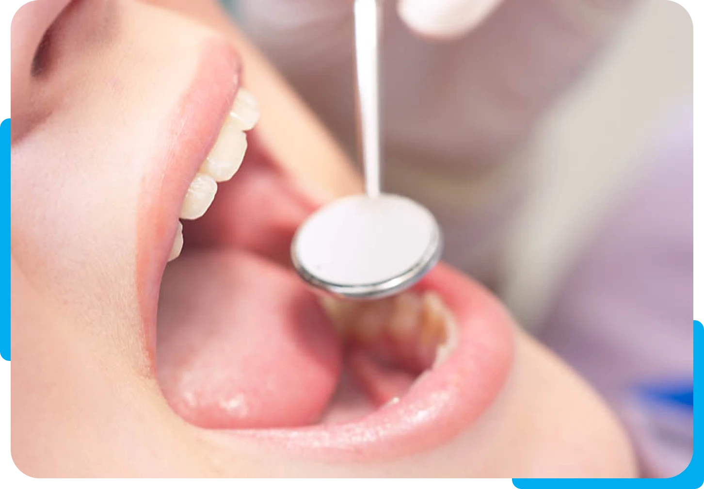 Dentist examining patient's mouth