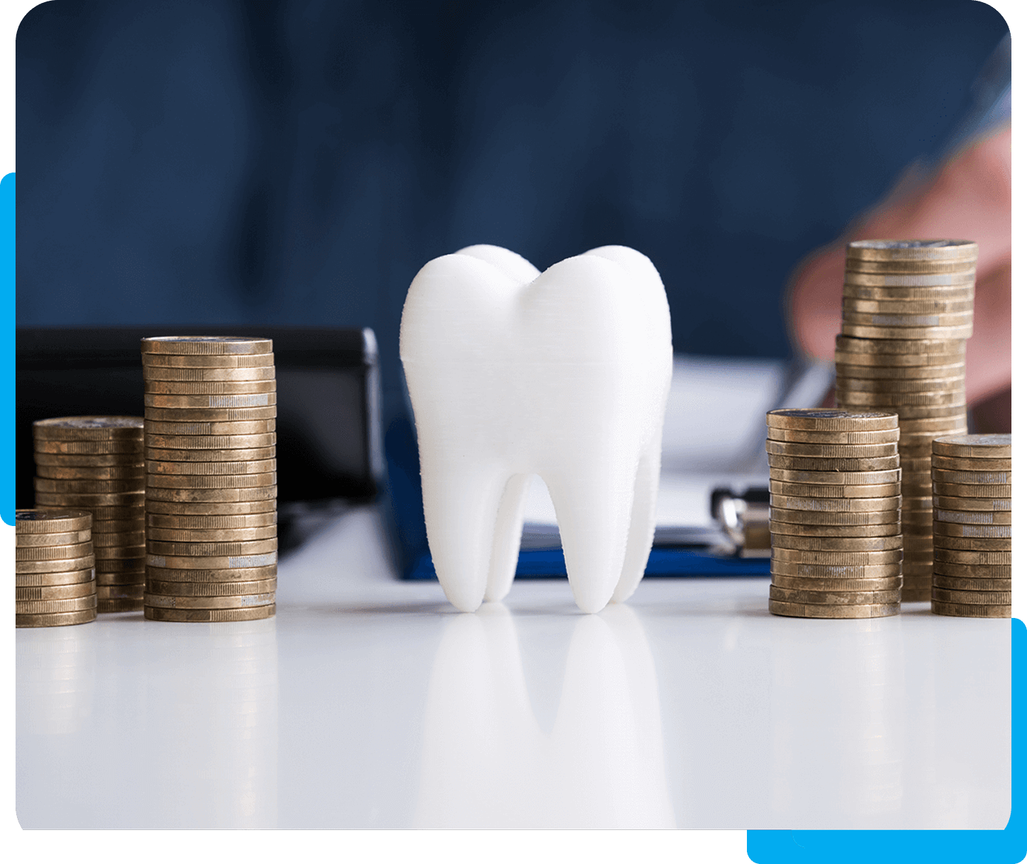 Tooth with piles of coins on table